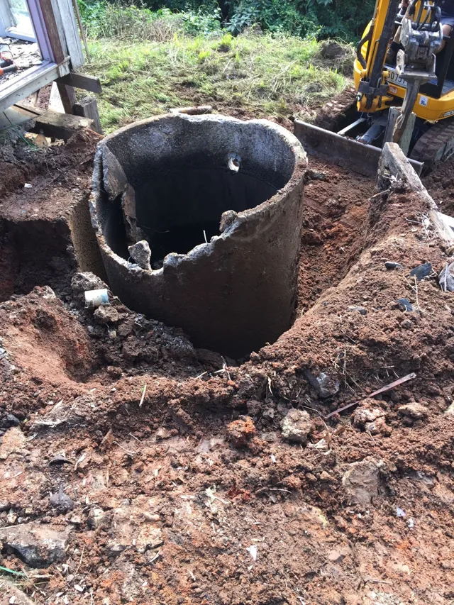 Old wastewater tank exposed during replacement work