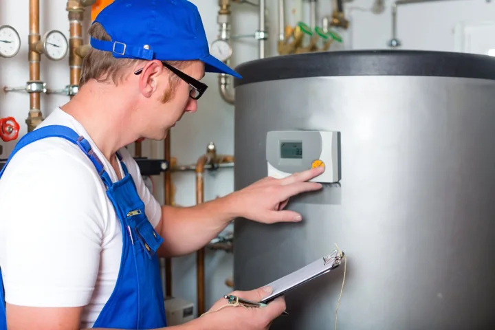 Plumber carrying out routine maintenance plumbing