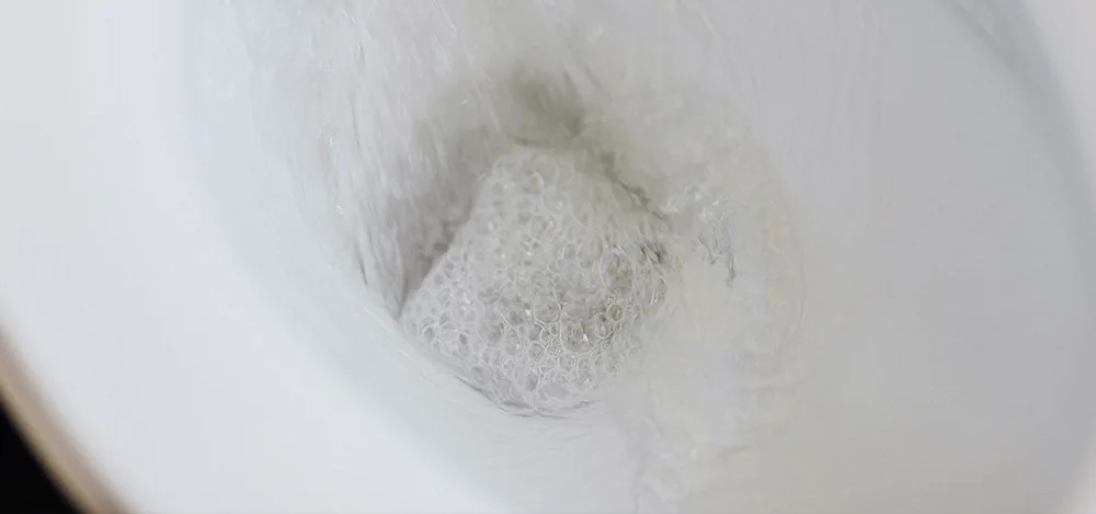 Water flushing inside a toilet bowl