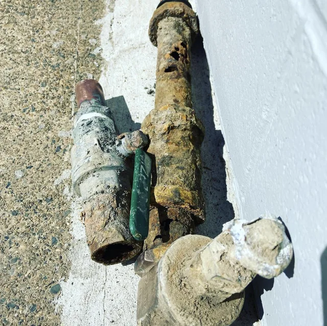 Corroded water pipe and old valve removed for replacement