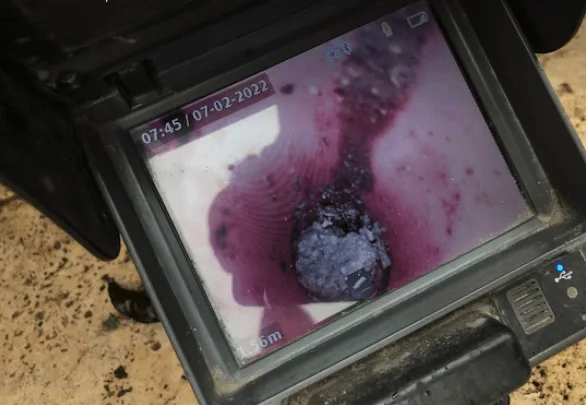 CCTV inspection screen showing the inside of a drainage pipe