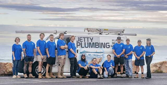 The Jetty Plumbing team beside their work van on the Coffs Coast