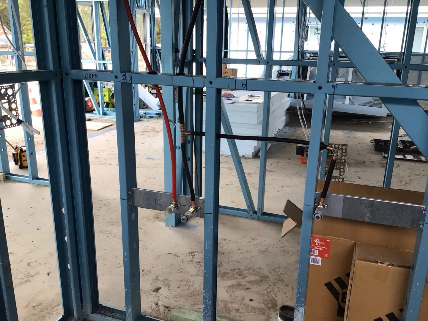 Water pipework installed within steel framing on a new home project