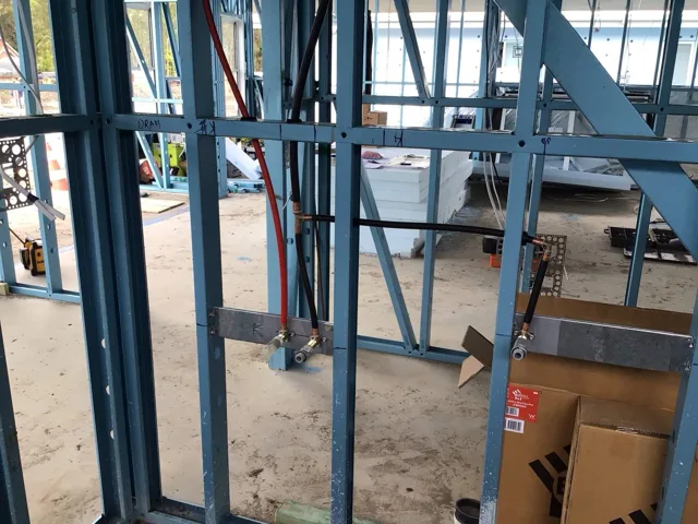 Water pipework installed within steel framing on a new home project
