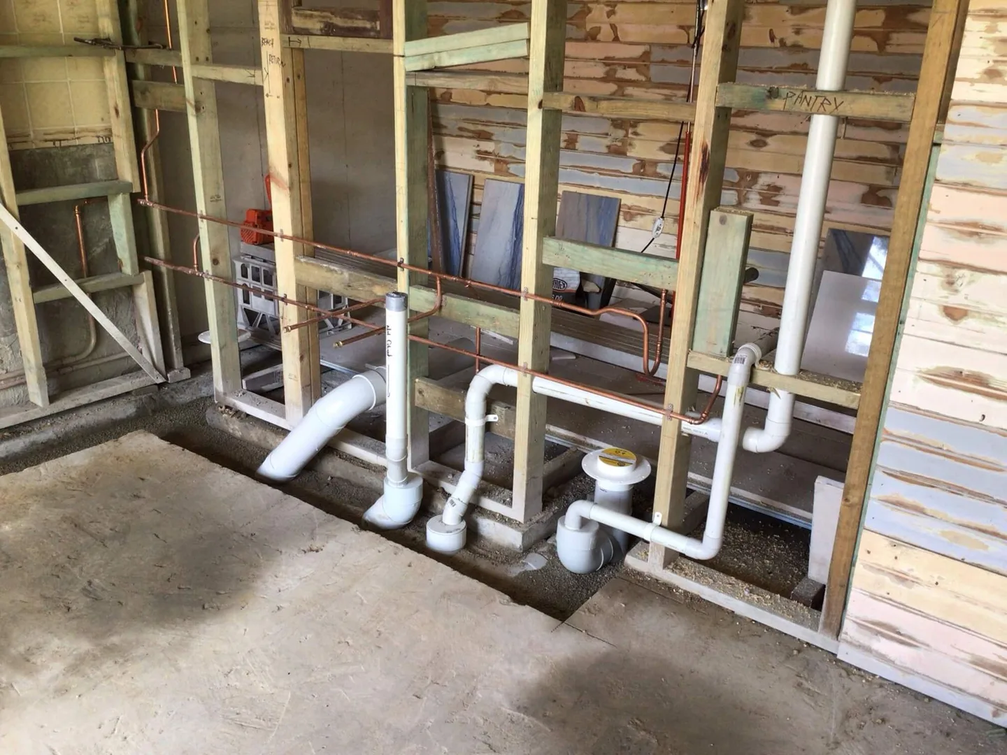 Waste and water pipework exposed during a renovation