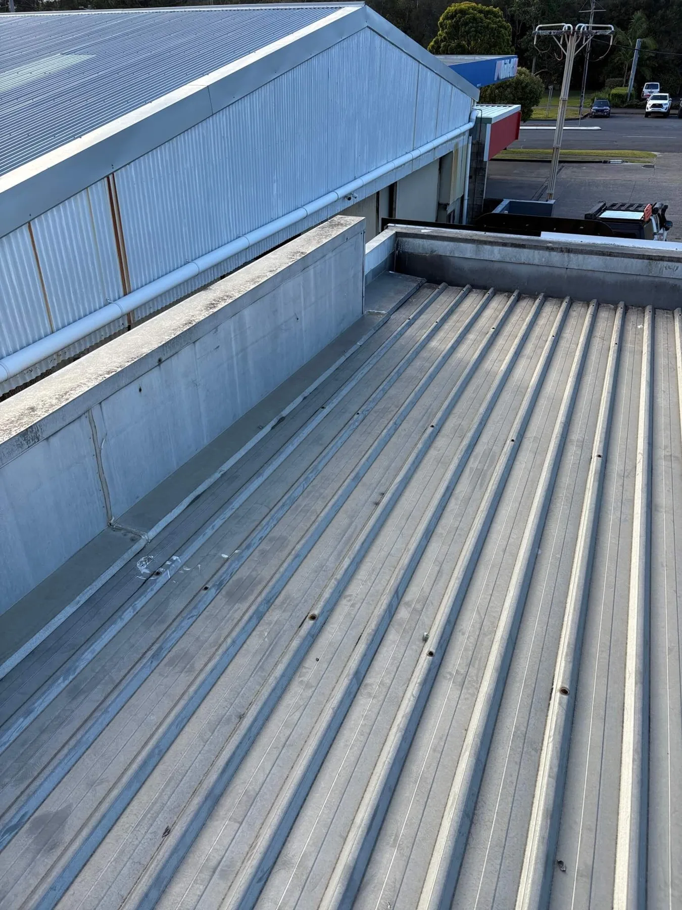 Metal roof sheets and junction flashing on a property